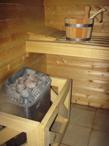 Construire un sauna chez soi : le poêle